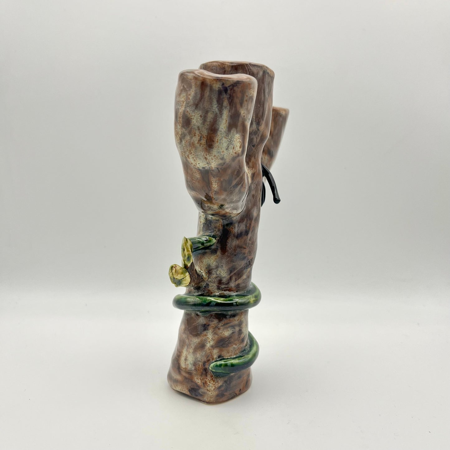 The cat, snake and bird candle holder