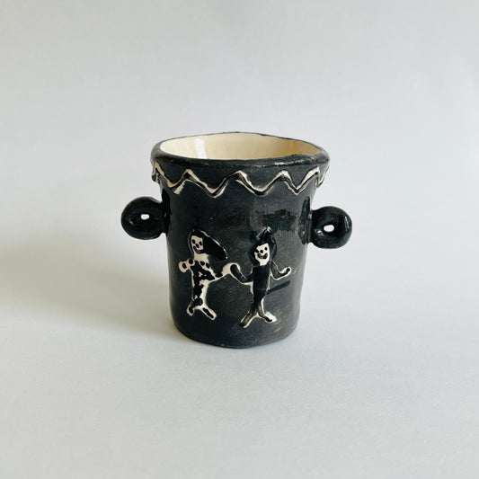 Very ancient pots - two dogs b&w