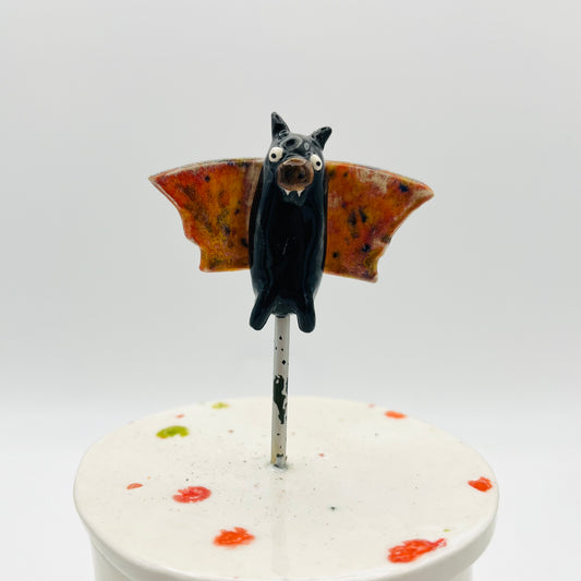 Flying bat lidded pot