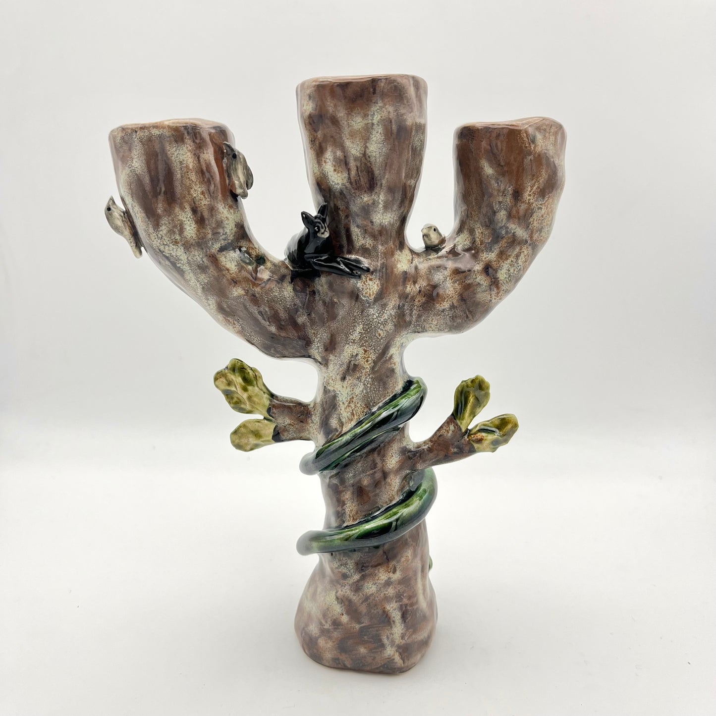 The cat, snake and bird candle holder