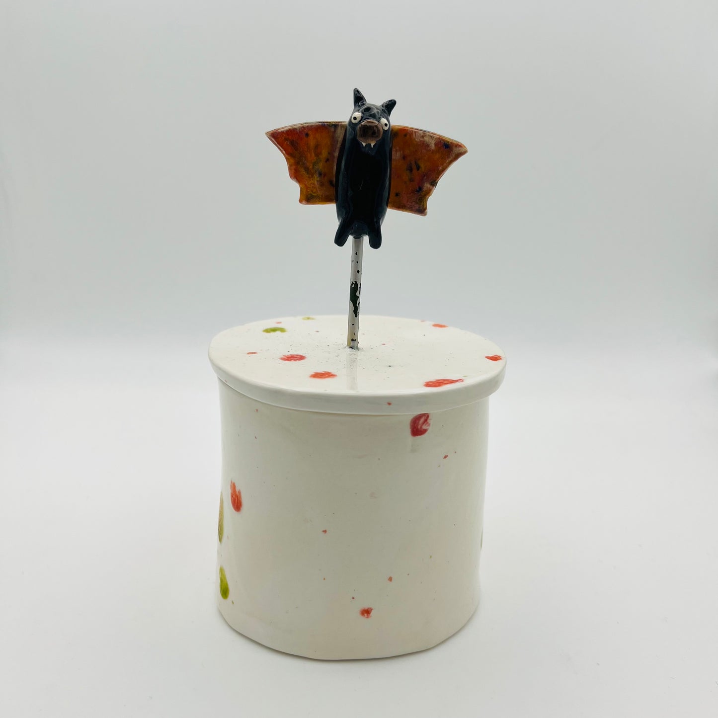 Flying bat lidded pot